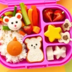 Colorful bento box for kids packed with healthy and fun school lunch ideas.